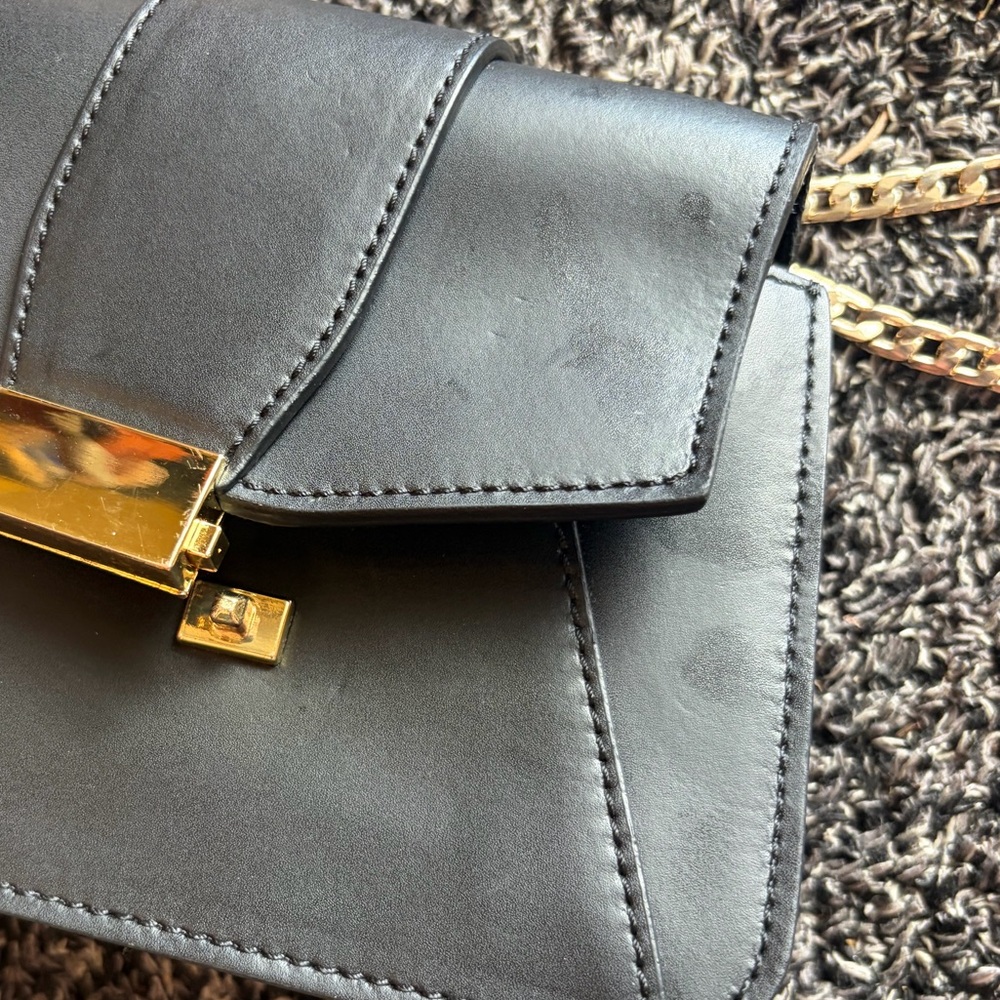 Elegant Black Leather Bag with Gold Accents